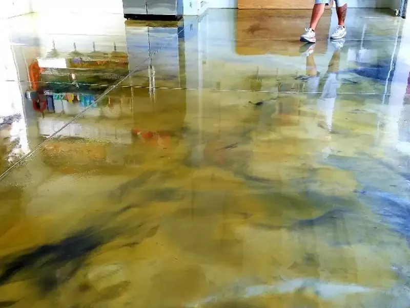 Premium metallic epoxy floor installation in a luxury Central Florida home